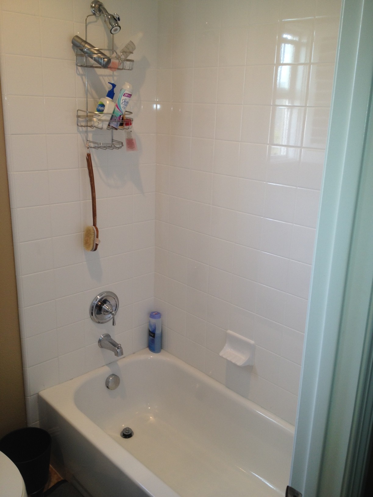 Before - The owner of this home was tired using a shower curtain to keep water out of the tub.